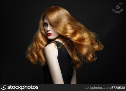 Chic woman with red hair on black background