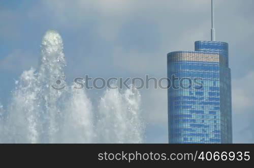 Chicago downtown skyscrapers behind the Buckingham Fountain waters. The Trump Tower is the skyscrapers in this shot. Awesome Chicago city center skyline in the United States of America.