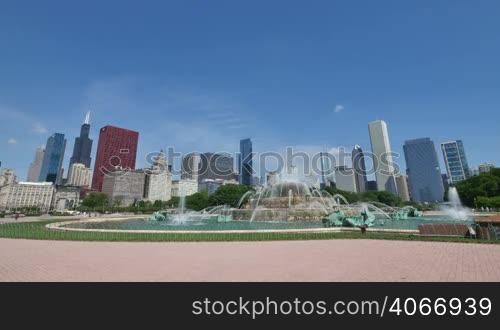Chicago downtown skyscrapers behind the Buckingham Fountain waters. The Willis Tower, the CNA Center, the Crain Communications Building or the Trump Tower are some of the skyscrapers in this shot. Awesome Chicago city center skyline in the United States of America.