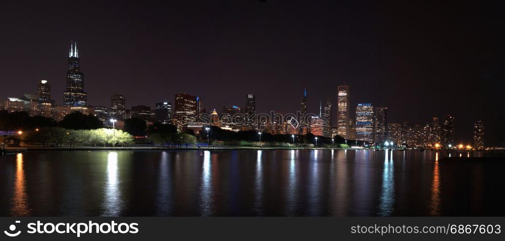 Chicago night skyline across Lake Michigan.