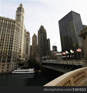 Chicago River scene with bridge and boat in Chicago, Illinois.