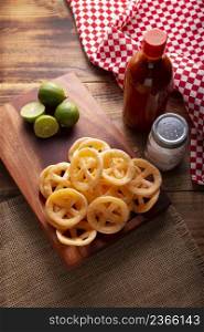 Chicharrones de Harina. Also known as duros, duritos, Mexican wagon wheels or pinwheels, they are a very popular snack made from flour, commonly accompanied with hot sauce and lemon juice.