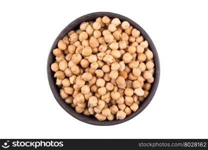 Chick-pea in black bowl. Beans isolated on a white background. Close-up.