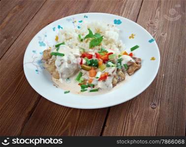 Chicken ala King - King-style Chicken. diced chicken in a cream sauce, and often with mushrooms, and vegetables, served over rice