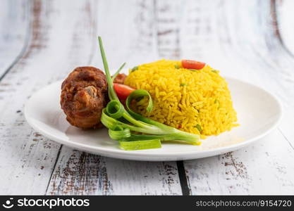 Chicken Biryani in a plate on a white wooden floor