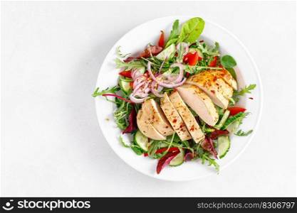 Chicken breast grilled and fresh vegetable salad