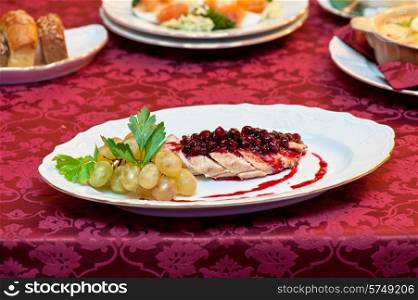 chicken breast meat with cranberry sauce. chicken breast