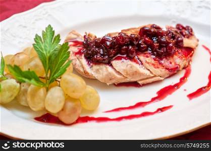 chicken breast meat with cranberry sauce. chicken breast
