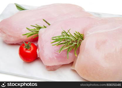 chicken breast on white plate on white background