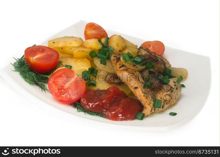 Chicken breast with roasted potatoes and fresh tomatoes. Isolated.