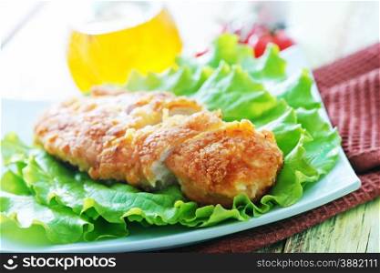 chicken breast with salad on the plate