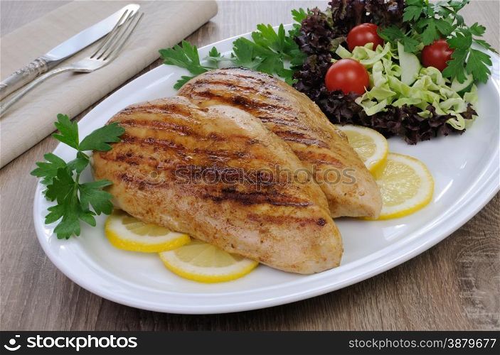 chicken breasts grilled garnish of salad vegetables