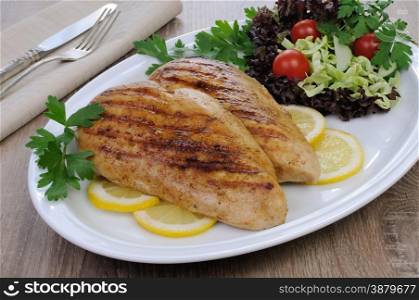 chicken breasts grilled garnish of salad vegetables