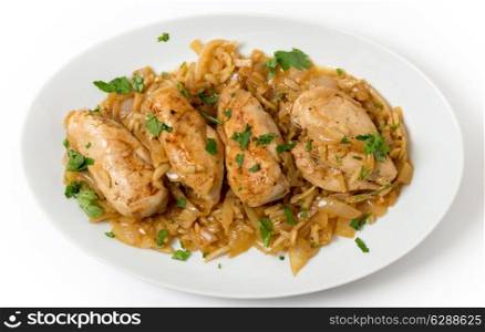 Chicken breasts in an almond, onion and wine sauce, garnished with flat-leaf parsley