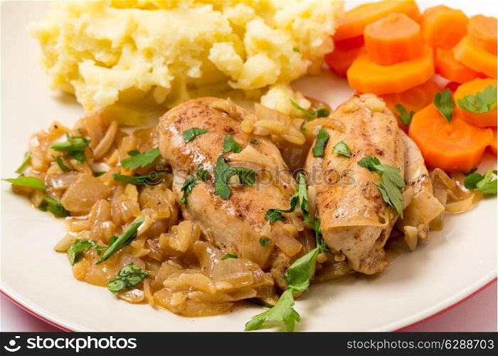 Chicken breasts in an almond, onion and wine sauce, served wth mashed potatoes and carrots