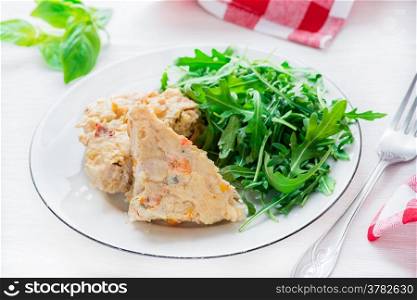 Chicken casserole with green salad, selective focus