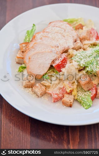 Chicken ceasar salad. Chicken ceasar salad closeup photo