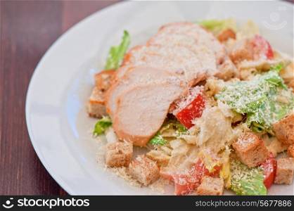 Chicken ceasar salad closeup photo