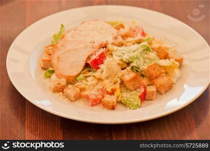 Chicken ceasar salad closeup photo