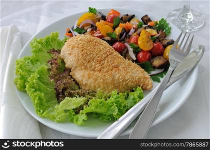 Chicken cutlet with eggplant in sesame with tomato and pepper