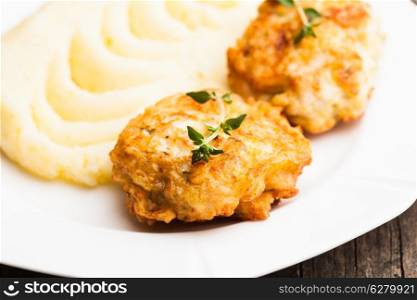 Chicken cutlets and potato puree in a plate close up