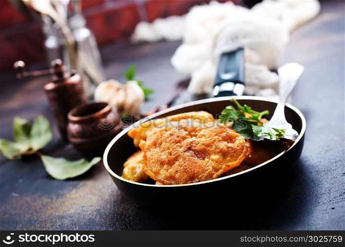 chicken cutlets in pan, cutlets with fresh greens and spice