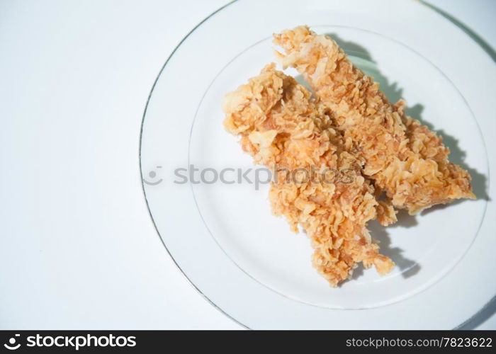 Chicken Deep fried. Placed on a white plate. Fried chicken pieces and variety.