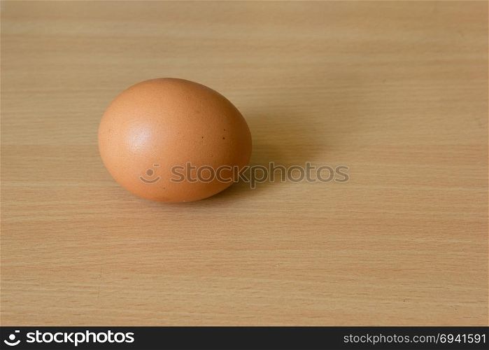 Chicken egg on the wooden table