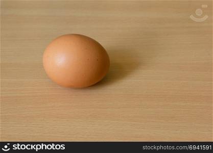 Chicken egg on the wooden table