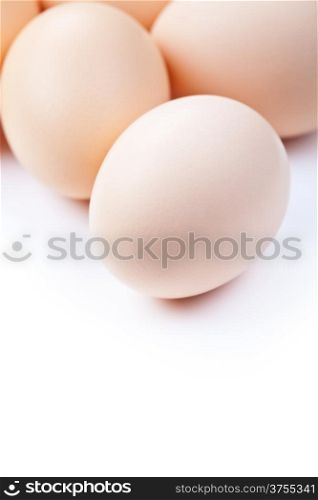 Chicken eggs on white background with copy space