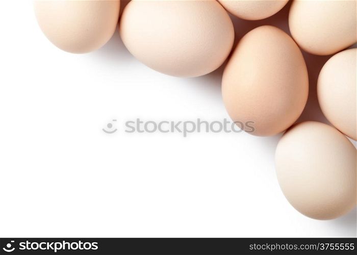 Chicken eggs on white background with empty room for text. Top view