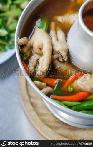 chicken feet soup. sour and spicy chicken feet soup in hot bowl