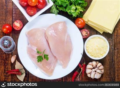 chicken fillet on plate and on a table
