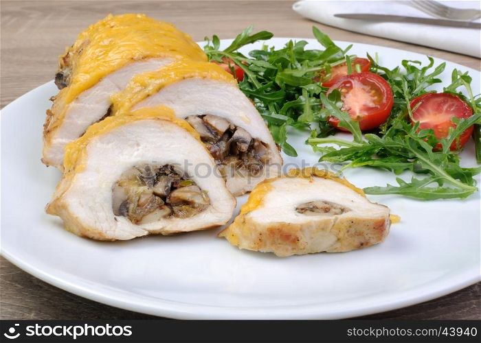 Chicken fillet stuffed with mushrooms on the cheese crust
