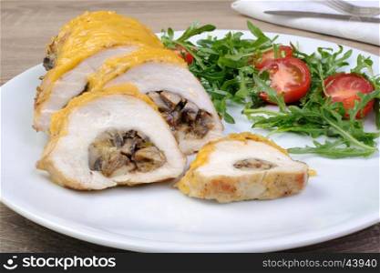 Chicken fillet stuffed with mushrooms on the cheese crust