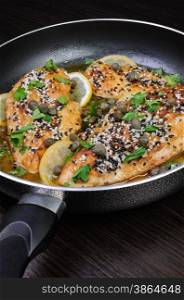 Chicken fillet with sesame seeds in wine-lemon gravy capers and herbs