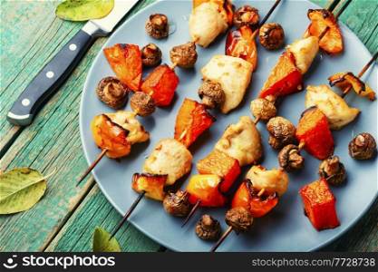 Chicken kebab with pumpkin and mushrooms on skewers. Kebabs with meat,pumpkin and mushrooms