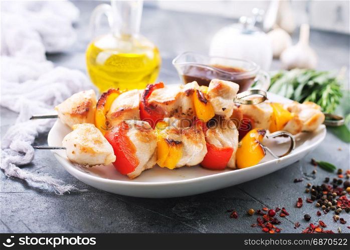 chicken kebab with vegetables on the plate