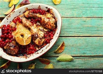 Chicken legs with berry sauce.Chicken roasted drumsticks.Copy space. Chicken drumsticks with viburnum,space for text