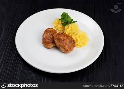 Chicken meat cutlet with mashed potatoes on white plate. Chicken meat cutlet with mashed potatoes