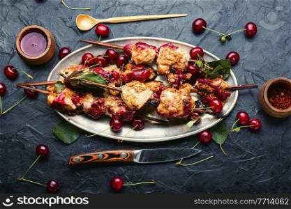 Chicken meat on wooden skewers in cherry sauce.Chicken skewers in tray. Chicken breast kebab with berry marinade