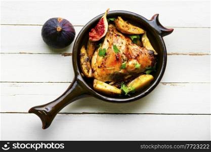 Chicken meat roasted with potatoes and figs.Meat cooked with figs.. Chicken baked with potatoes and figs