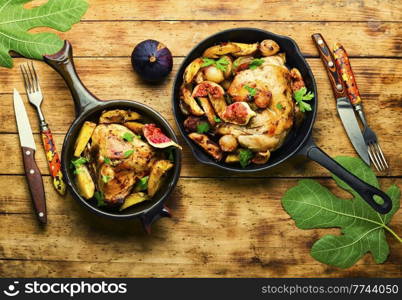 Chicken meat roasted with potatoes and figs.Roasted chicken with fruits and vegetables. Chicken baked with potatoes and figs