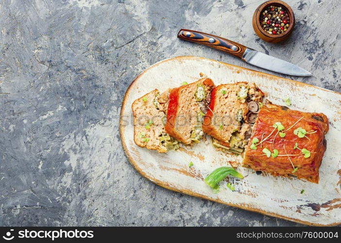 Chicken meat terrine stuffed with pepper and liver.Appetizing meatloaf.Copy space. Meat terrine or meatloaf.