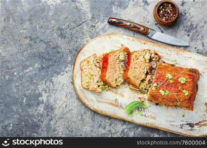 Chicken meat terrine stuffed with pepper and liver.Appetizing meatloaf.Copy space. Meat terrine or meatloaf.