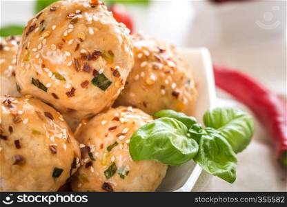 Chicken meatballs under sweet chili pepper sauce