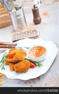 chicken nuggets with sauce, unhealthy food, stock photo