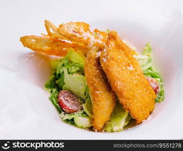 Chicken nuggets with vegetables salad on plate