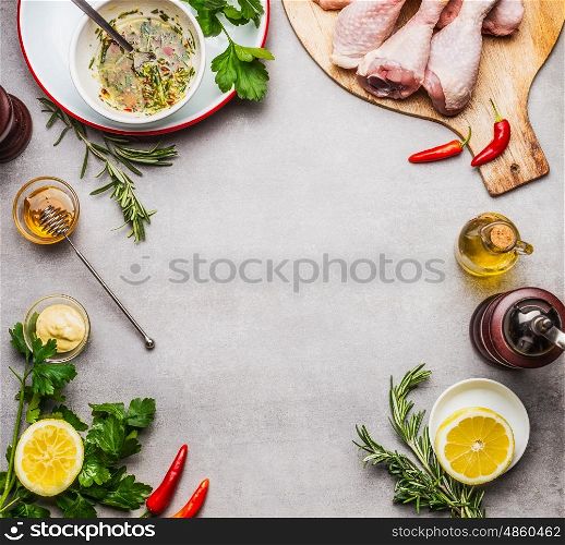 Chicken pieces preparation with marinade ingredients for grill or cooking on gray background , top view, frame