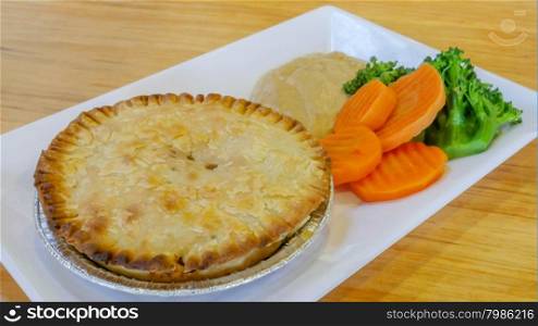 Chicken pot pie with carrot and broccoli. Chicken pot pie